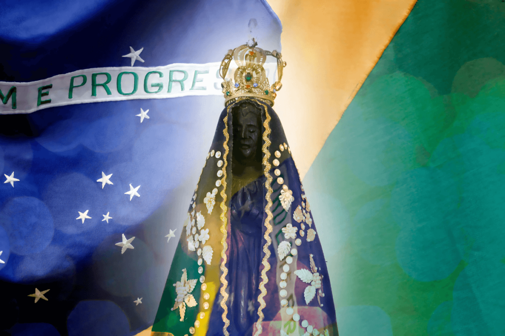 estátua da imagem de nossa senhora Aparecida e bandeira do Brasil.
Sabor e Fé.